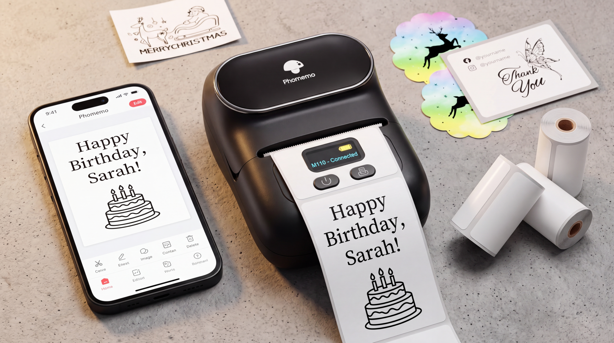 Phomemo M110 portable smart thermal label maker printer on a minimalist desk workspace